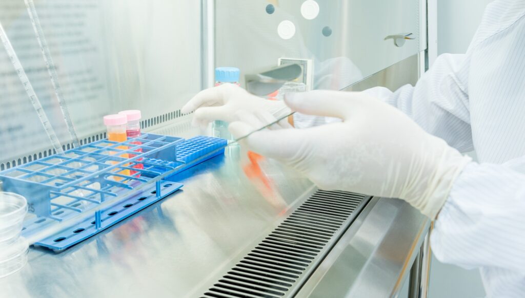 A,Scientist,In,Sterile,Coverall,Gown,Preparing,Growth,Medium,And