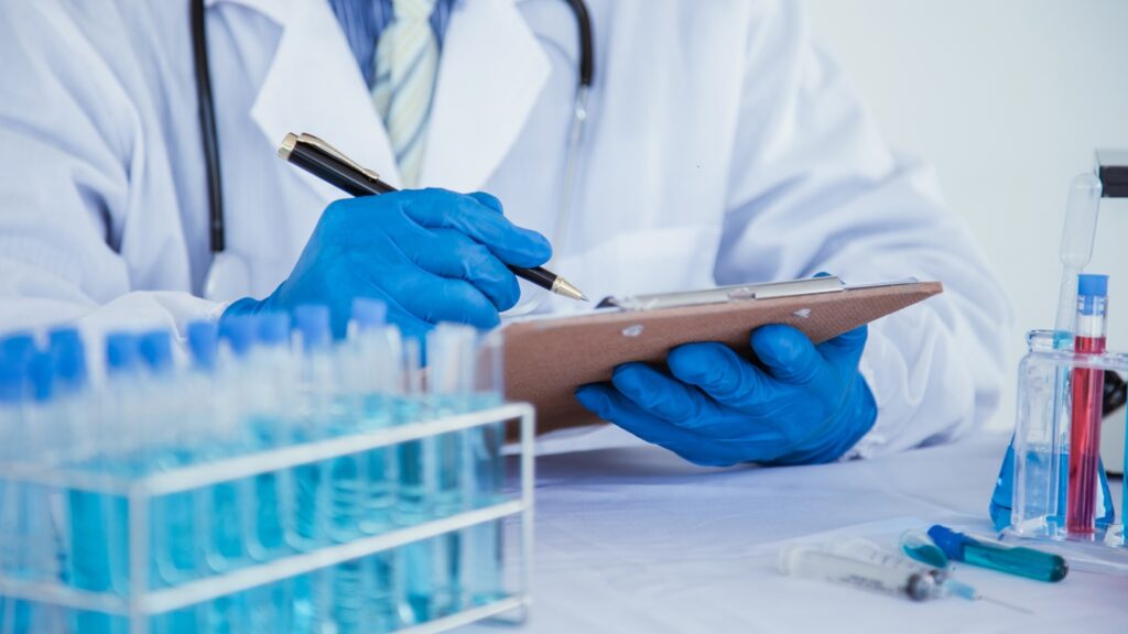 Medical,Or,Scientific,Researcher,Researching,And,Experimenting,Multi-colored,Solution,,Vial