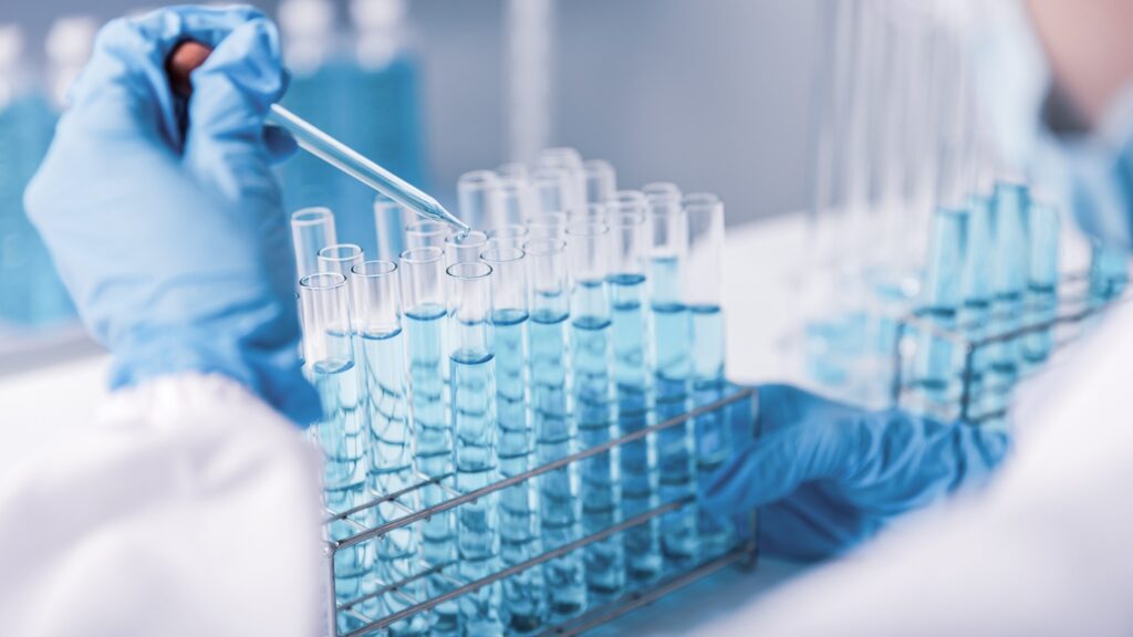 Chemist,scientist,Hand,Dropping,Chemical,Liquid,Into,Test,Tube,,Science,Research