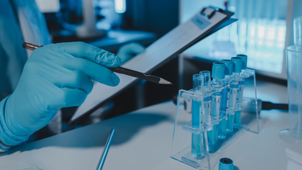 A,Scientist,Is,Working,In,Laboratory,And,Taking,Note,Of