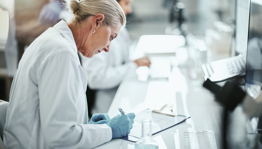 Clipboard,,Woman,And,Scientist,Writing,In,Laboratory,For,Medical,Research